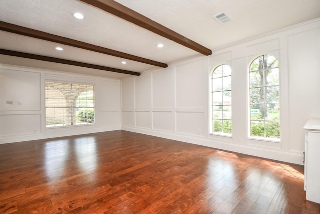 1927 Willowlake Dr, Houston, TX 77077 - unfurnished living room with a decorative wall, beamed ceiling, dark wood finished floors, and recessed lighting