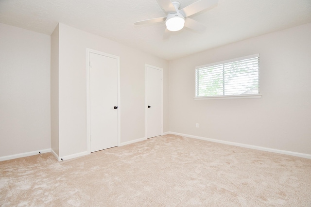 1927 Willowlake Dr, Houston, TX 77077 - unfurnished bedroom featuring carpet, baseboards, and ceiling fan