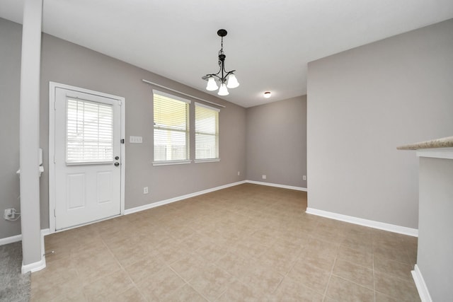 7447 Oakwood Canyon Dr, Cypress, TX 77433 - unfurnished living room featuring a chandelier, baseboards, and light tile patterned floors