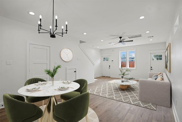 8417 Venus St Unit A B, Houston, TX 77088 - dining room featuring baseboards, wood finished floors, a chandelier, recessed lighting, and a ceiling fan