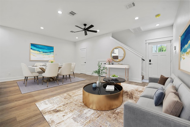 8417 Venus St Unit A B, Houston, TX 77088 - living area with wood finished floors, recessed lighting, ceiling fan, baseboards, and stairway