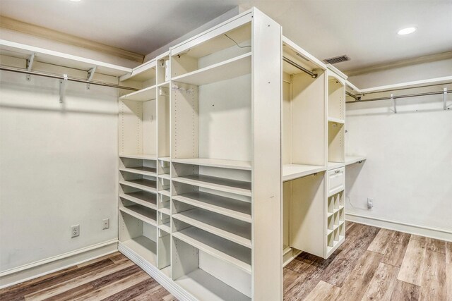 12906 Ivyforest Dr, Cypress, TX 77429 - spacious closet featuring wood finished floors