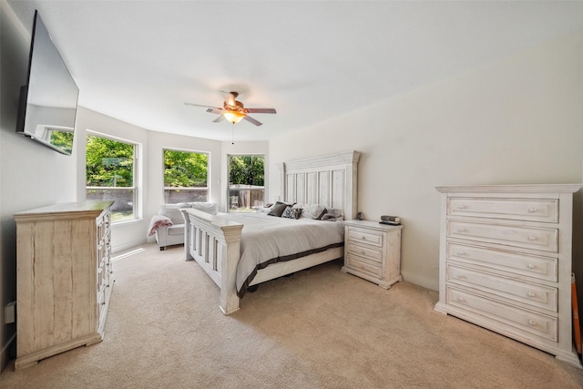 14619 Hampton Green Ln, Houston, TX 77044 - bedroom featuring light colored carpet, a ceiling fan, and baseboards