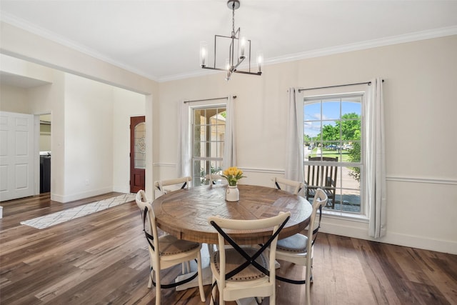 14619 Hampton Green Ln, Houston, TX 77044 - dining area featuring a chandelier, plenty of natural light, ornamental molding, wood finished floors, and baseboards