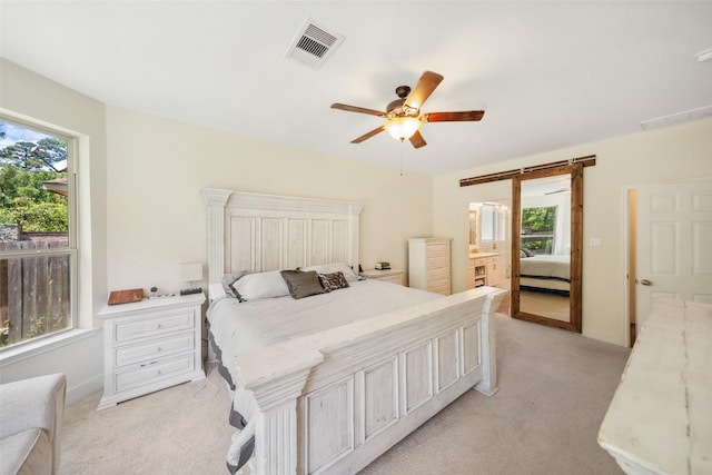 14619 Hampton Green Ln, Houston, TX 77044 - bedroom with light carpet, ceiling fan, ensuite bathroom, and baseboards