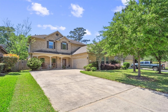 14619 Hampton Green Ln, Houston, TX 77044 - traditional-style home featuring brick siding, driveway, a garage, and covered porch