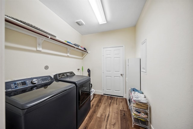 14619 Hampton Green Ln, Houston, TX 77044 - laundry area featuring dark wood-style floors, washing machine and dryer, and baseboards