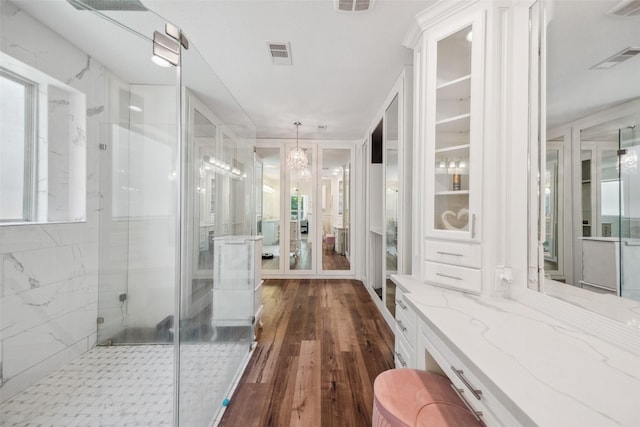 14619 Hampton Green Ln, Houston, TX 77044 - full bath with a marble finish shower, wood finished floors, a chandelier, and vanity