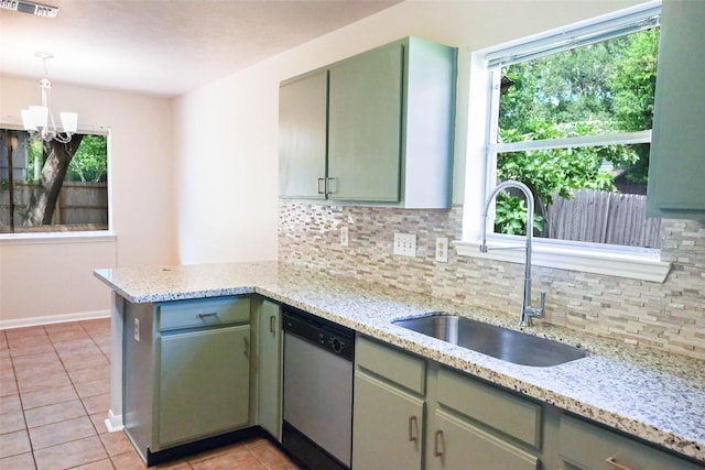 18389 Ten Oaks Ct, Porter, TX 77365 - kitchen with dishwasher, a sink, a chandelier, tasteful backsplash, and a peninsula