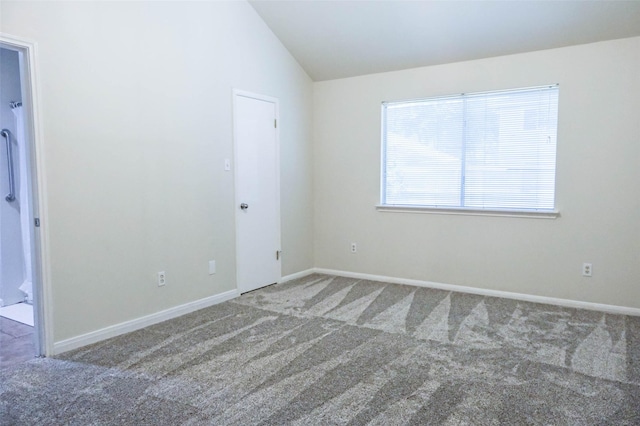 18389 Ten Oaks Ct, Porter, TX 77365 - spare room featuring carpet, vaulted ceiling, and baseboards