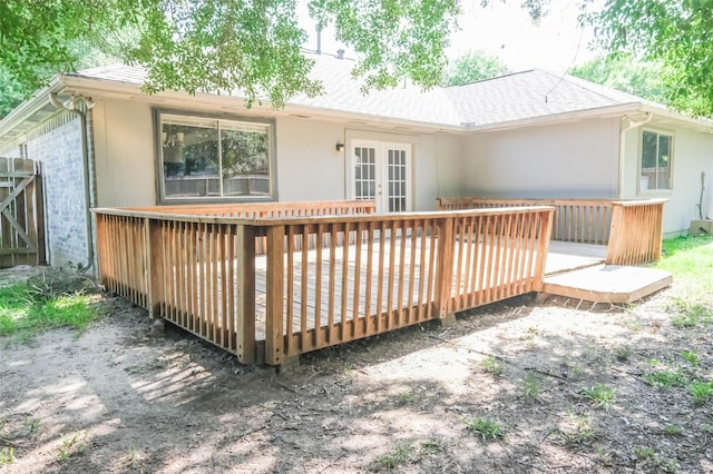 18389 Ten Oaks Ct, Porter, TX 77365 - back of house featuring french doors, a wooden deck, brick siding, and roof with shingles