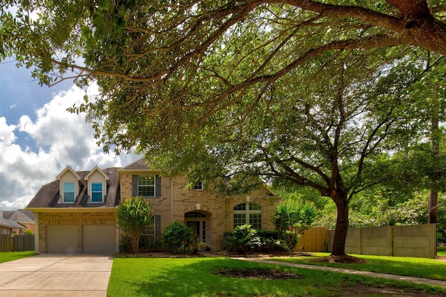 4815 N Pine Brook Way, Houston, TX 77059 - traditional-style home featuring concrete driveway, brick siding, and an attached garage