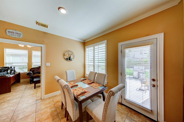 4815 N Pine Brook Way, Houston, TX 77059 - dining area featuring crown molding and light tile patterned flooring