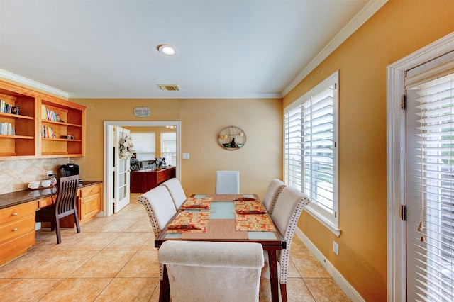 4815 N Pine Brook Way, Houston, TX 77059 - dining area with light tile patterned floors, ornamental molding, and built in study area
