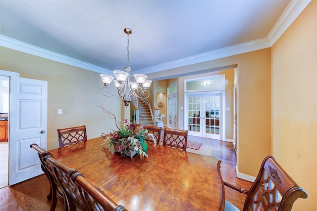 4815 N Pine Brook Way, Houston, TX 77059 - dining space featuring wood finished floors, crown molding, a chandelier, and french doors