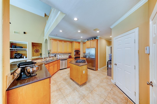 4815 N Pine Brook Way, Houston, TX 77059 - kitchen featuring stainless steel appliances, crown molding, a kitchen island, backsplash, and light brown cabinets