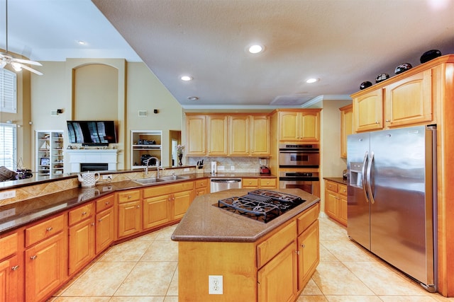 4815 N Pine Brook Way, Houston, TX 77059 - kitchen with appliances with stainless steel finishes, tasteful backsplash, light tile patterned flooring, a kitchen island, and ceiling fan