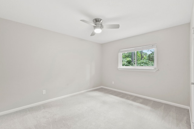 19 Sylvan Forest Dr, The Woodlands, TX 77381 - empty room featuring carpet, baseboards, and ceiling fan
