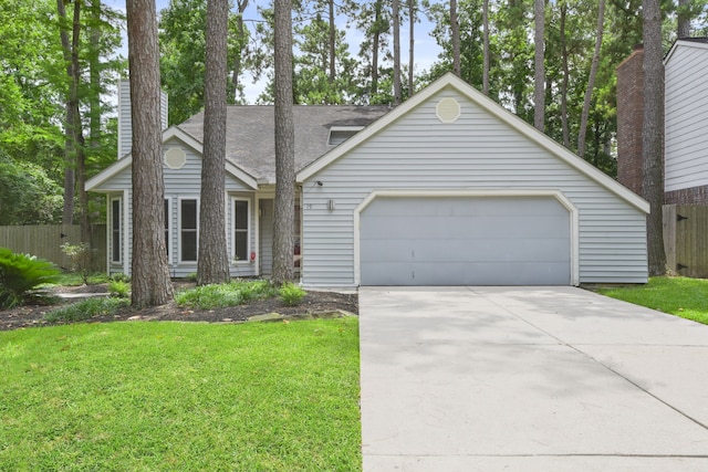 19 Sylvan Forest Dr, The Woodlands, TX 77381 - view of front of house featuring a garage, concrete driveway, and roof with shingles