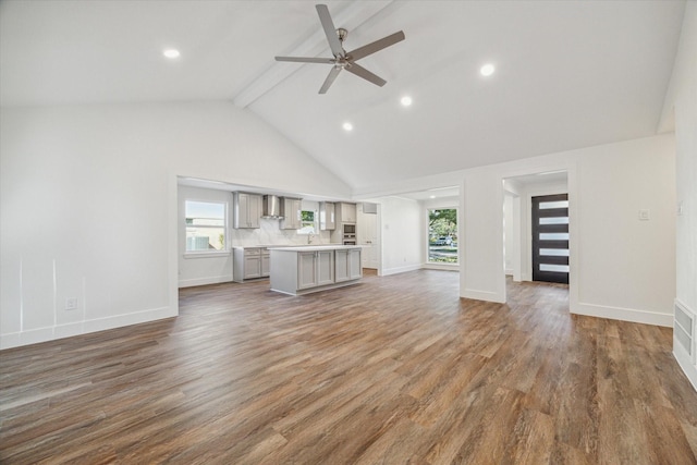 2306 Walnut Bend Ln, Houston, TX 77042 - unfurnished living room featuring beam ceiling, ceiling fan, high vaulted ceiling, baseboards, and wood finished floors