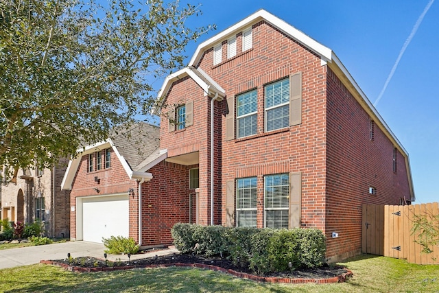 2813 Bottiglia Way, League City, TX 77573 - traditional home featuring brick siding, concrete driveway, a garage, and a gate