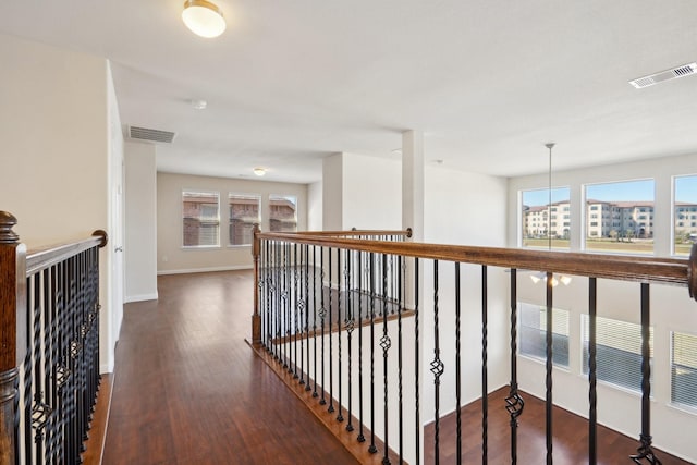 2813 Bottiglia Way, League City, TX 77573 - hall featuring wood finished floors, an upstairs landing, and baseboards