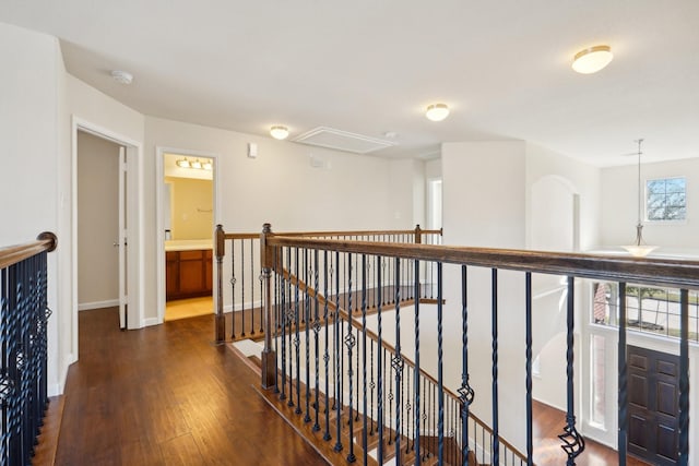 2813 Bottiglia Way, League City, TX 77573 - hallway with an upstairs landing, wood finished floors, baseboards, and attic access