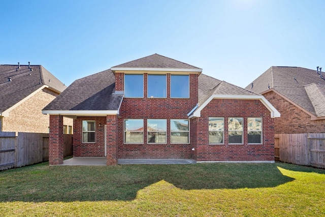 2813 Bottiglia Way, League City, TX 77573 - back of house featuring a shingled roof, brick siding, and a patio