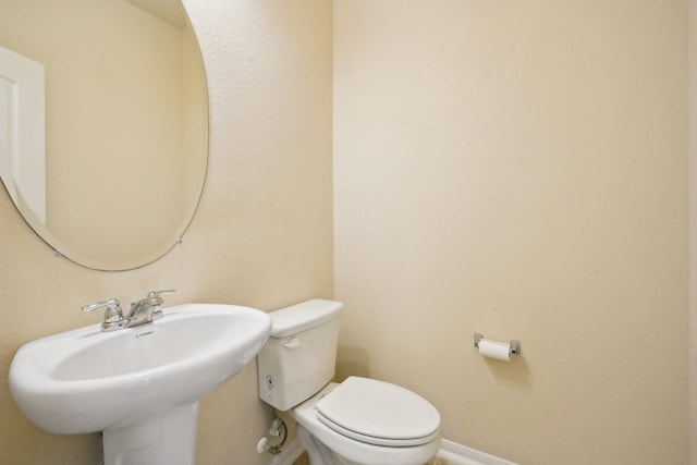 2813 Bottiglia Way, League City, TX 77573 - half bath featuring toilet, a sink, and baseboards