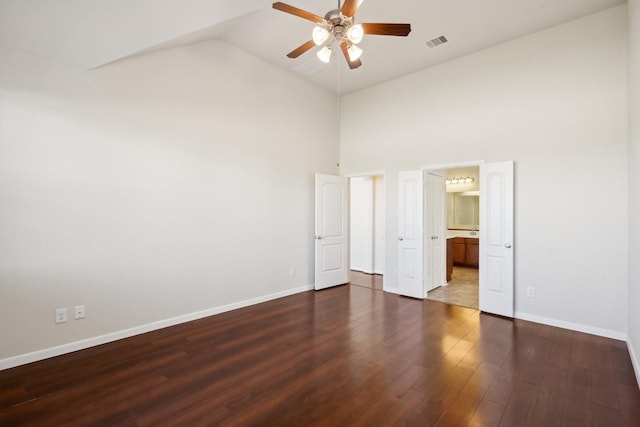 2813 Bottiglia Way, League City, TX 77573 - unfurnished bedroom with wood finished floors, high vaulted ceiling, baseboards, ensuite bathroom, and a ceiling fan