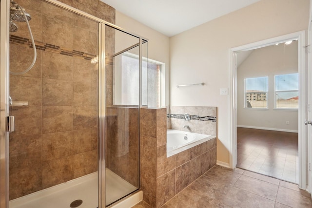 2813 Bottiglia Way, League City, TX 77573 - bathroom with a bath, tile patterned flooring, and a stall shower