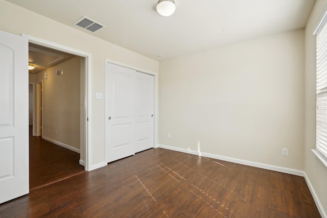 2813 Bottiglia Way, League City, TX 77573 - unfurnished bedroom with attic access, dark wood finished floors, baseboards, and a closet