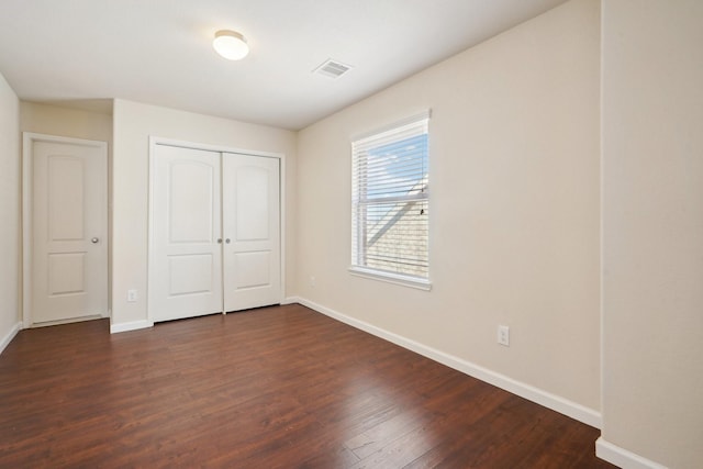 2813 Bottiglia Way, League City, TX 77573 - unfurnished bedroom with baseboards, dark wood-style floors, and a closet