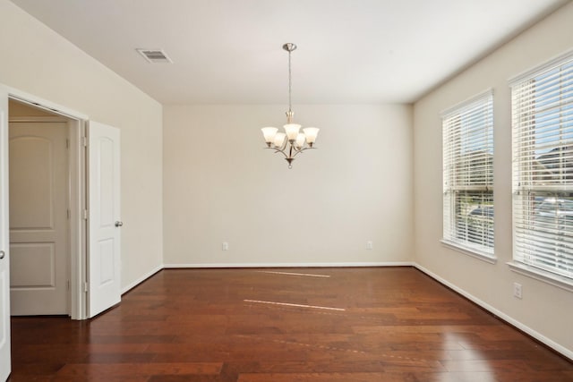 2813 Bottiglia Way, League City, TX 77573 - unfurnished room featuring a chandelier, wood finished floors, and baseboards