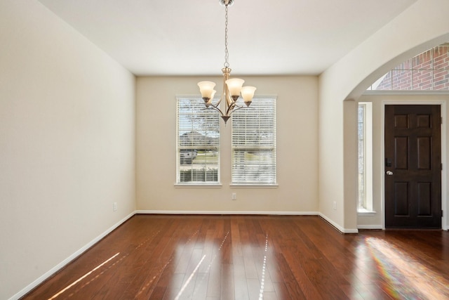 2813 Bottiglia Way, League City, TX 77573 - entryway with a chandelier, hardwood / wood-style floors, arched walkways, and baseboards