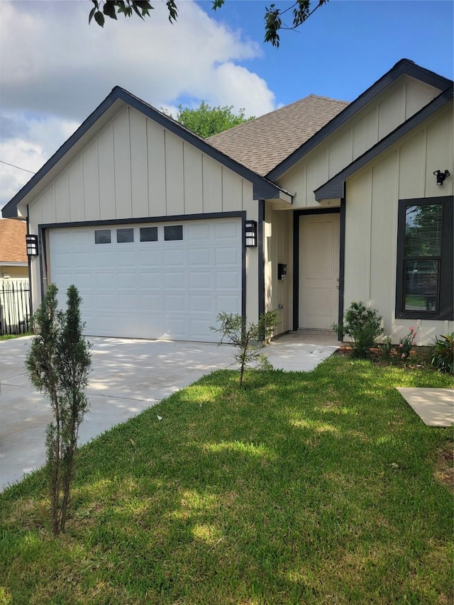 4354 Phlox St, Houston, TX 77051 - single story home with board and batten siding, a shingled roof, driveway, and a front yard