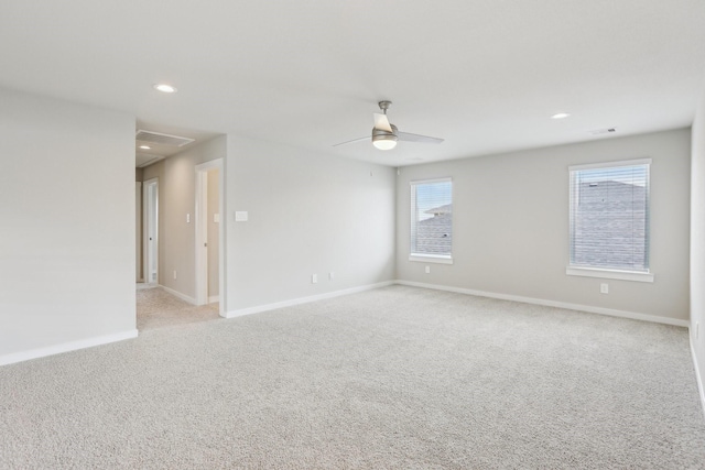 29211 Pikes Peak Dr, Katy, TX 77494 - spare room with light carpet, baseboards, ceiling fan, recessed lighting, and attic access