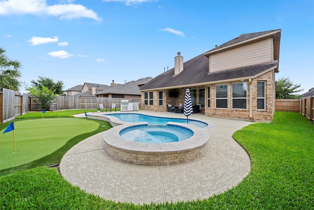 20714 Great Pines Dr, Cypress, TX 77433 - view of pool featuring a putting area, a patio area, and a pool with connected hot tub