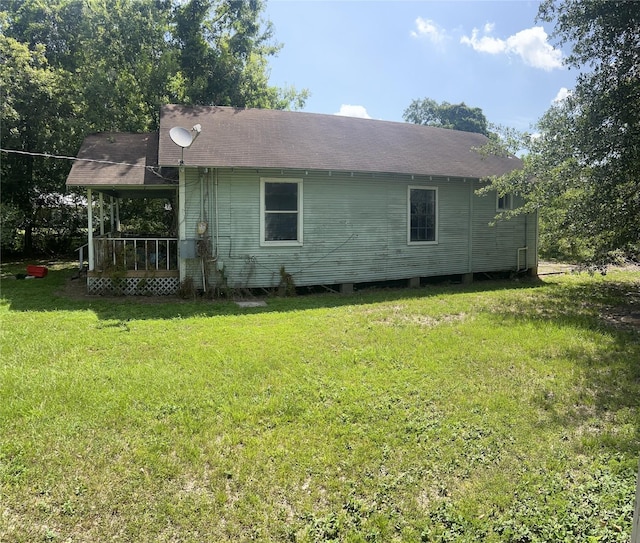 720 Birch, Vidor, TX 77662 - view of home's exterior featuring a yard and a shingled roof