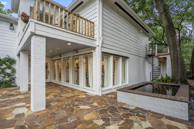 11 Twin Circle Dr, Houston, TX 77042 - view of patio with stairs and a balcony