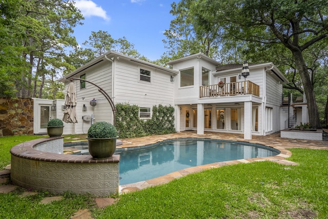11 Twin Circle Dr, Houston, TX 77042 - back of house with a balcony, an outdoor pool, a yard, and french doors