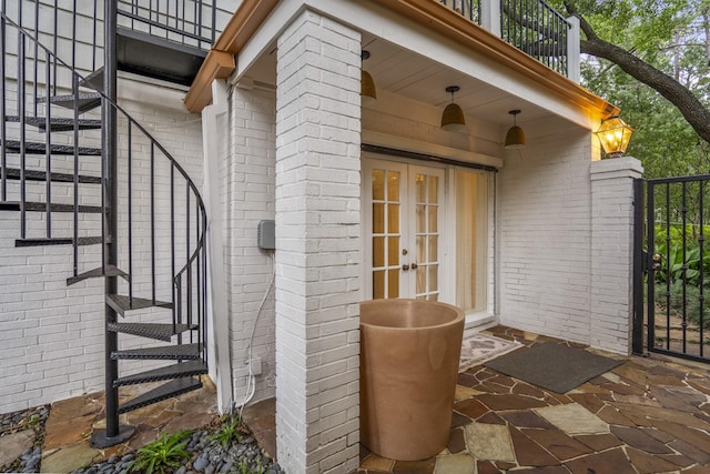 11 Twin Circle Dr, Houston, TX 77042 - doorway to property featuring brick siding, a balcony, and french doors