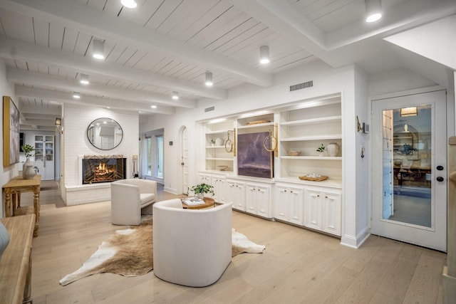 11 Twin Circle Dr, Houston, TX 77042 - living area with light wood-type flooring, wood ceiling with exposed beams, and a brick fireplace