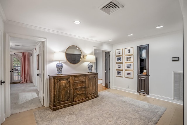 11 Twin Circle Dr, Houston, TX 77042 - hallway with light wood-type flooring, crown molding, recessed lighting, and baseboards