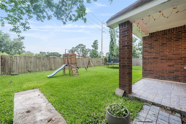 19315 Oak Station Dr, Humble, TX 77346 - view of yard with a trampoline and a playground