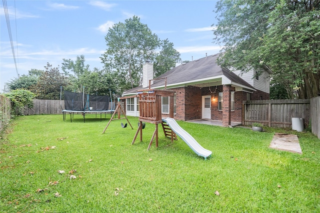 19315 Oak Station Dr, Humble, TX 77346 - view of yard with a trampoline
