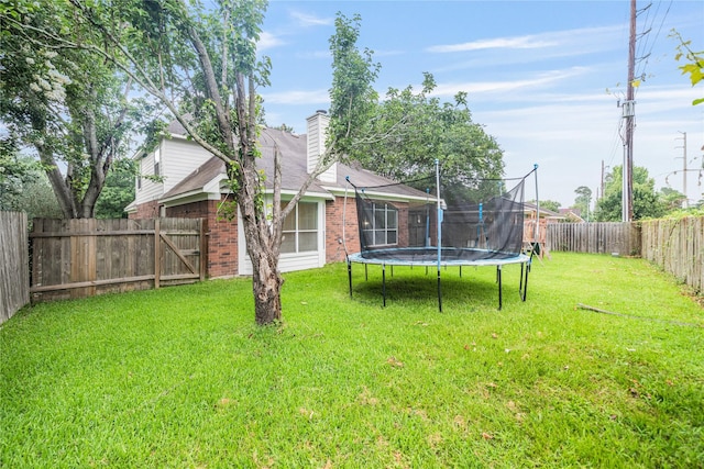 19315 Oak Station Dr, Humble, TX 77346 - view of yard featuring a trampoline