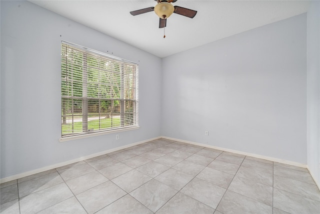 19315 Oak Station Dr, Humble, TX 77346 - spare room featuring a ceiling fan, baseboards, and light tile patterned flooring