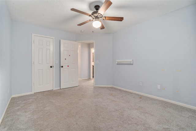 19315 Oak Station Dr, Humble, TX 77346 - unfurnished bedroom with carpet, baseboards, and a ceiling fan