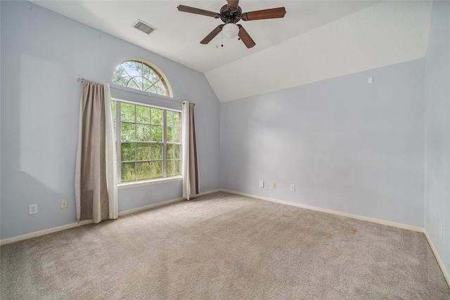 19315 Oak Station Dr, Humble, TX 77346 - empty room featuring ceiling fan, vaulted ceiling, carpet, and baseboards